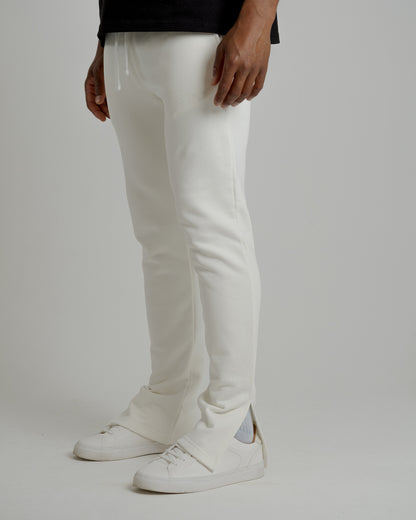 A male model wearing our off-white split sweatpants for a laid-back yet fashionable look.